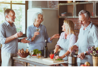 Adults in kitchen socializing